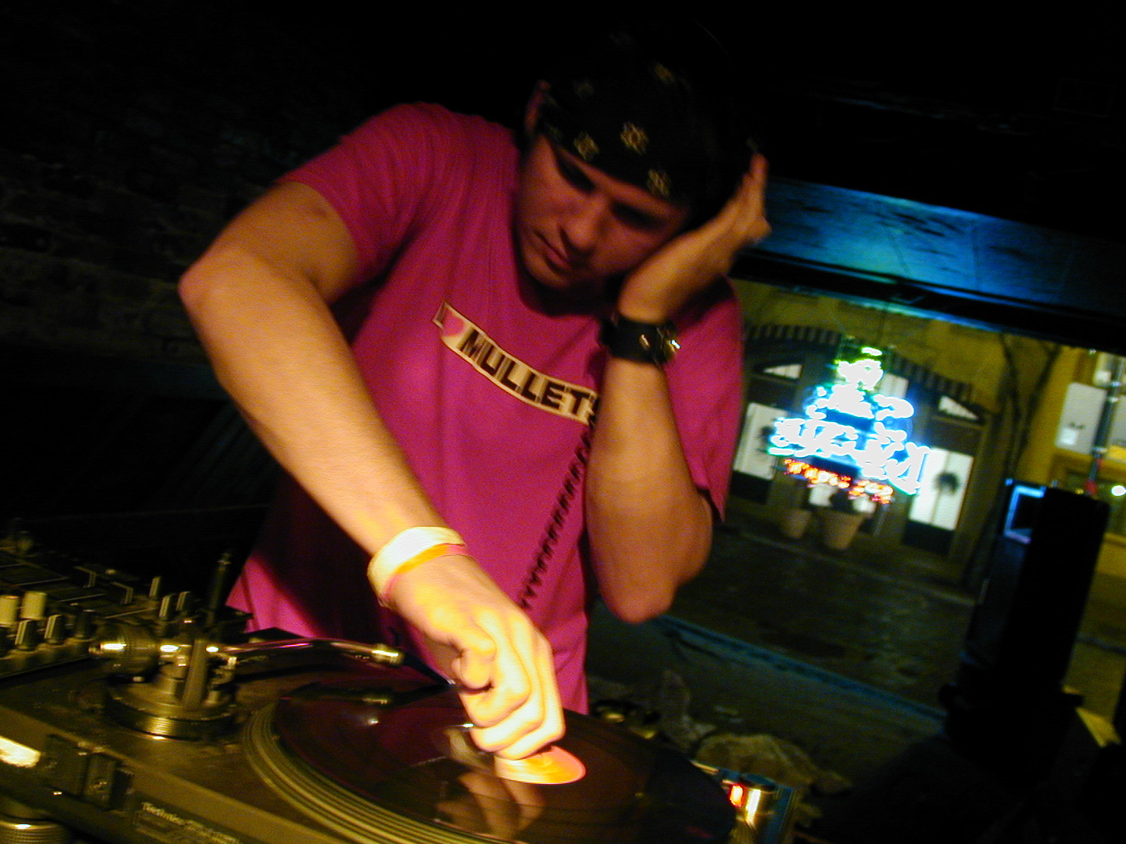 20-something DJ playing records